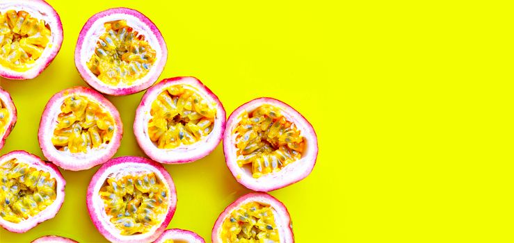 Passion fruit on yellow background.  Copy space
