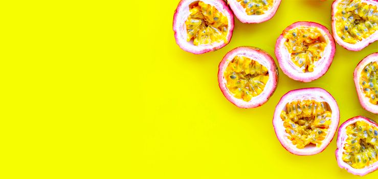 Passion fruit on yellow background.  Copy space