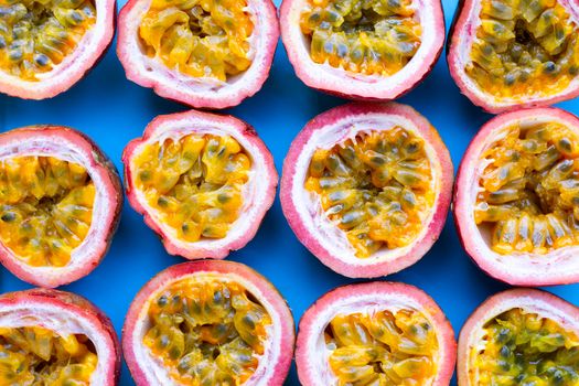 Passion fruit on blue background. Top view