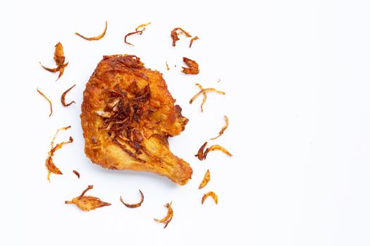 Fried chicken with garlic on white background. Copy space