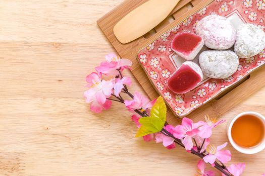 Daifuku traditional Japanese dessert eaten with tea background.