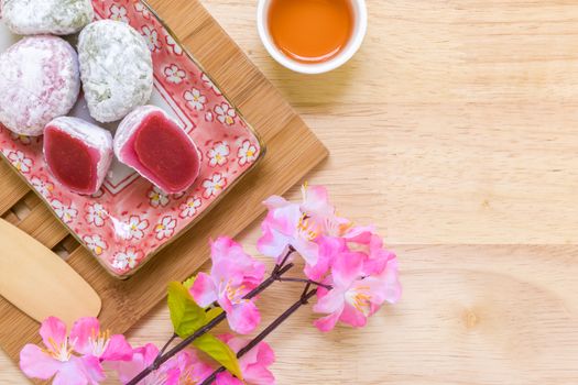 Daifuku traditional Japanese dessert eaten with tea background.