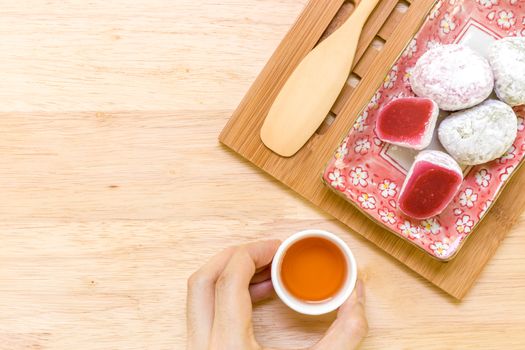 Daifuku traditional Japanese dessert eaten with tea background.