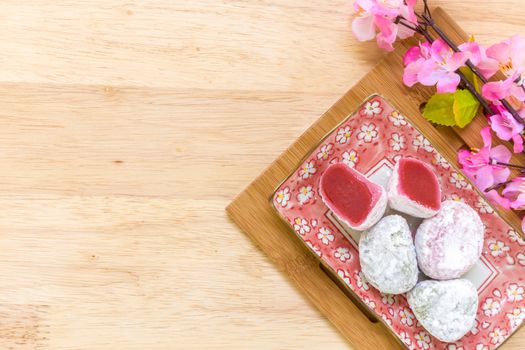 Daifuku traditional Japanese dessert eaten with tea background.