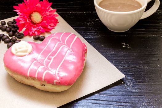 Fresh donut or doughnut with cup of hot coffee for relaxing moment.