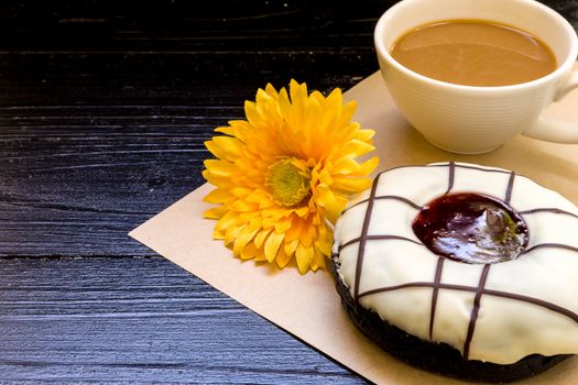 Fresh donut or doughnut with cup of hot coffee for relaxing moment.