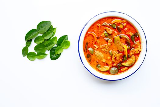 Red curry round eggplant with pork, white background. Copy space