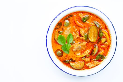 Red curry round eggplant with pork, white background. Copy space