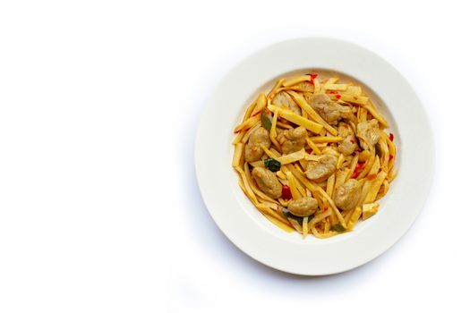 Spicy preserved bamboo shoot stir fried recipe with fish ball on white background. Copy space