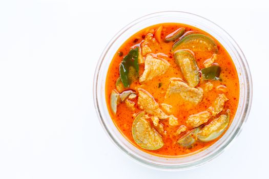 Red curry round eggplant with pork, white background. Copy space