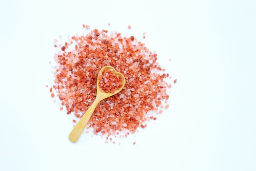 Pink himalayan salt on white background