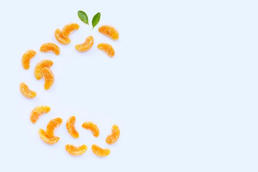 Fresh orange segments, High vitamin C, Letter C made of citrus fruits on white background. Copy space
