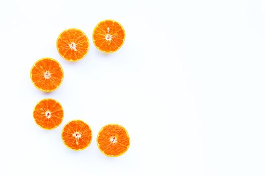 Fresh orange, High vitamin C, Letter C made of citrus fruits on white background. Copy space