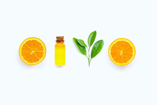 Natural citrus oil with fresh orange fruit and green leaves  on white background. High vitamin C. Top view