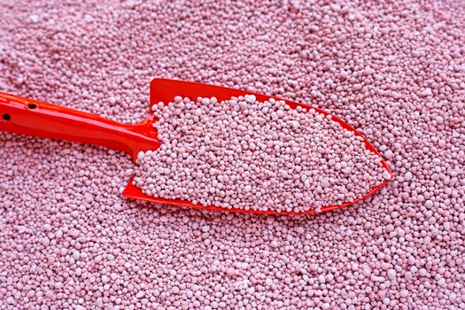 Chemical plant fertilizer with garden trowel for planting and plantation.