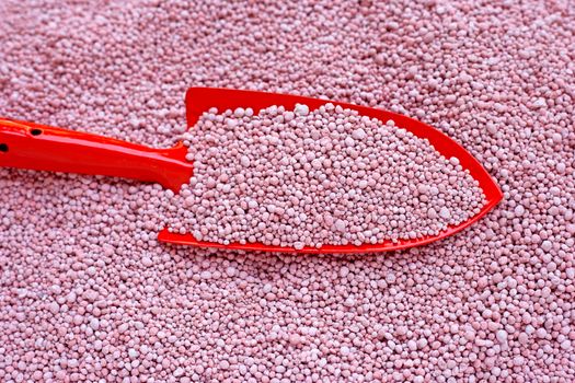 Chemical plant fertilizer with garden trowel for planting and plantation.