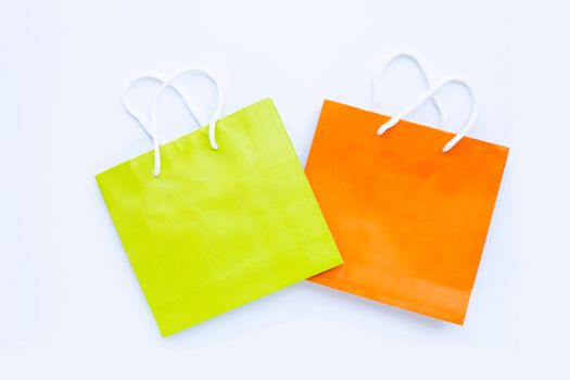 Paper shopping bags on white background. Top view