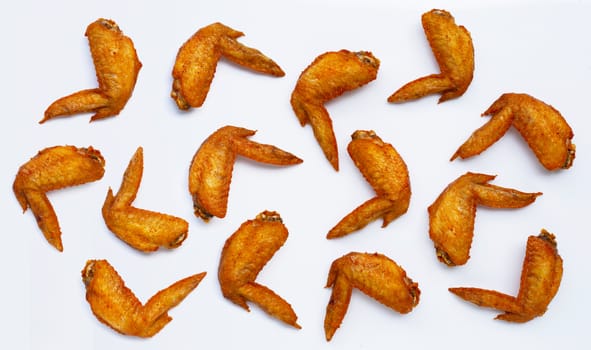 Fried chicken wings on white background.  Copy space