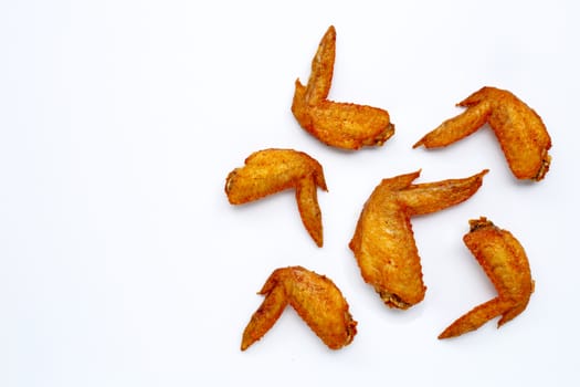 Fried chicken wings on white background.  Copy space