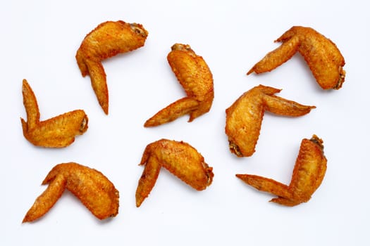 Fried chicken wings on white background.  Copy space