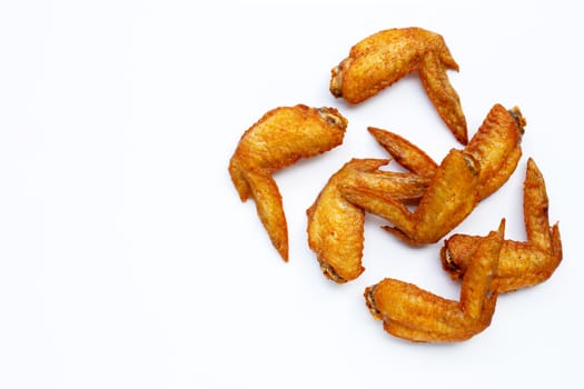 Fried chicken wings on white background.  Copy space