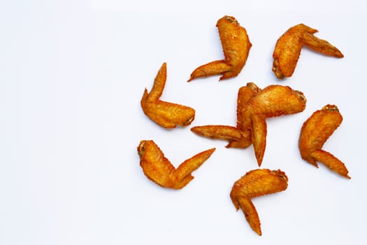 Fried chicken wings on white background.  Copy space