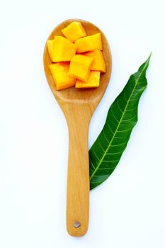 Tropical fruit, Mango on wooden spoon, white background. Top view
