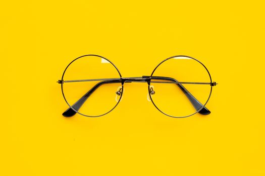 Eye Glasses on yellow background. Copy space