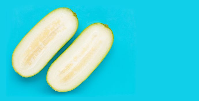 Winter melon on blue background. Copy space