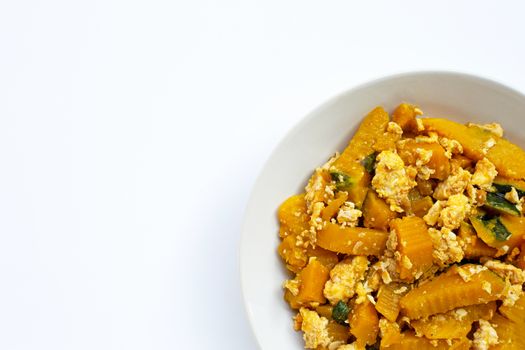 Stir-fried pumpkin with eggs on white background.