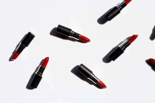 Flat lay composition, Lipsticks on white background with shadow. Beautiful Make-up concept