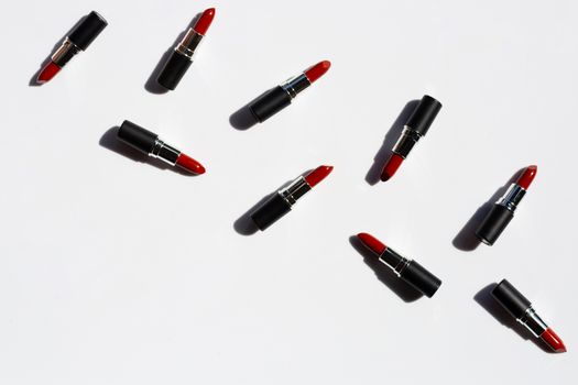 Flat lay composition, Lipsticks on white background with shadow. Beautiful Make-up concept