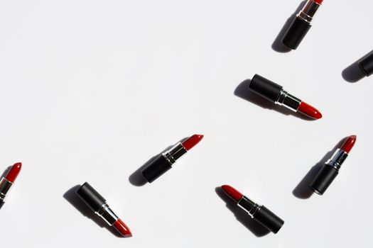 Flat lay composition, Lipsticks on white background with shadow. Beautiful Make-up concept