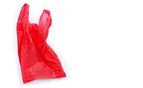 Red plastic bag on white background. Copy space