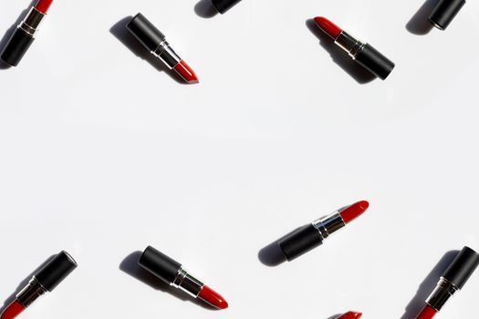 Flat lay composition, Lipsticks on white background with shadow. Beautiful Make-up concept
