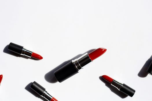Flat lay composition, Lipsticks on white background with shadow. Beautiful Make-up concept