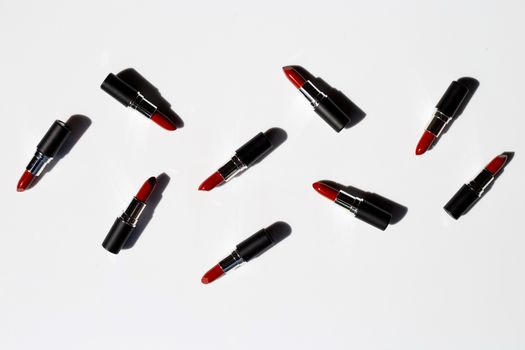 Flat lay composition, Lipsticks on white background with shadow. Beautiful Make-up concept