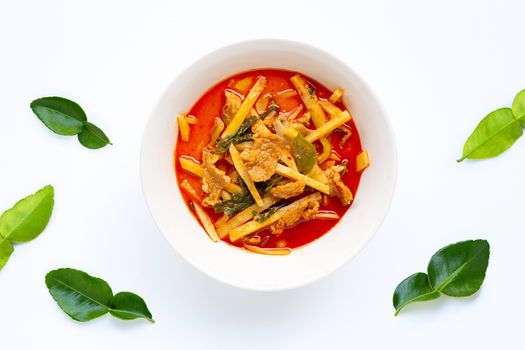 Red curry preserved bamboo shoot with pork, white background.