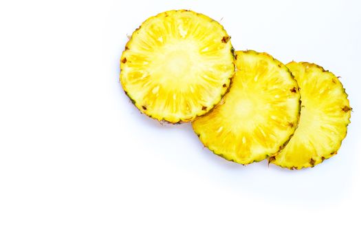 Fresh pineapple slices on white background. Copy space