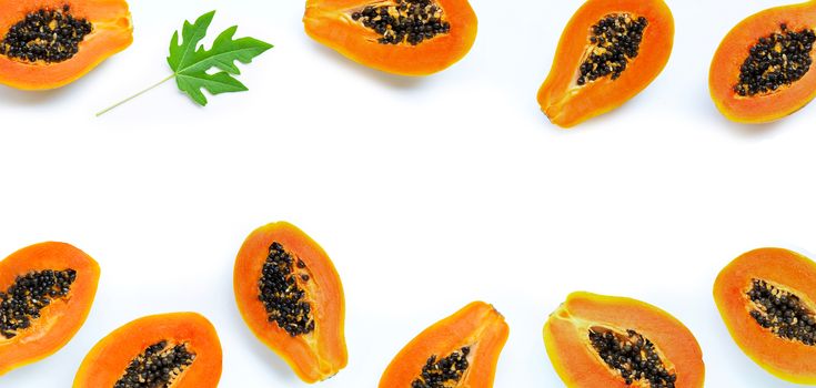 Frame made of papaya fruit on white background. Top view