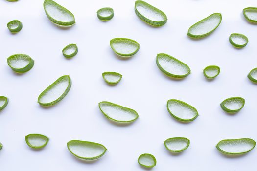 Aloe vera slices on white background.