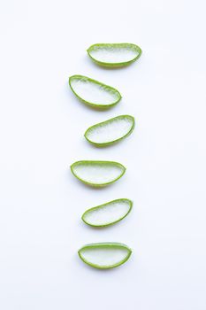 Aloe vera slices on white background.