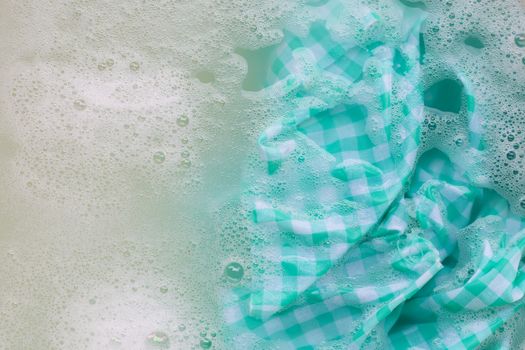 Soak a green white tablecloth before washing