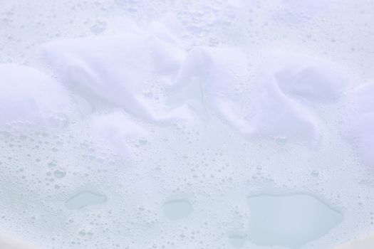 Soak a cloth before washing, white cloth