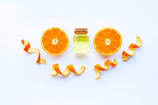Essential oil of orange on white background.