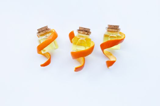 Essential oil of orange on white background.