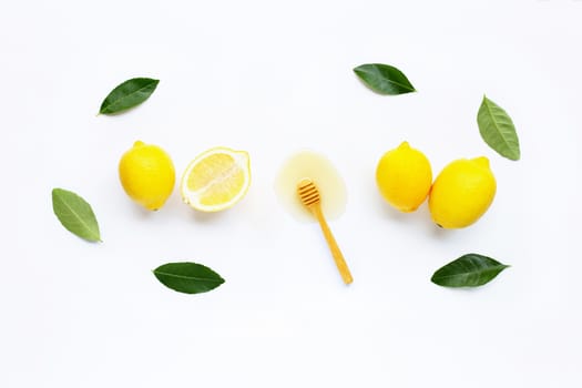 Fresh lemon with honey on white background.