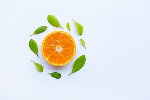 High vitamin C. Fresh orange citrus fruit with leaves isolated on white background. Copy space