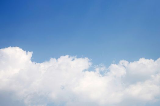 Blue sky background with cloud. Copy space