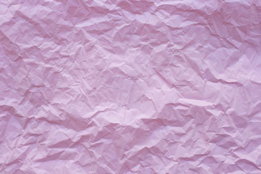 Pink crumpled recycle paper background